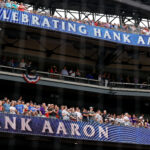 Celebrat5ing Hank Aaron's MLB record home run.