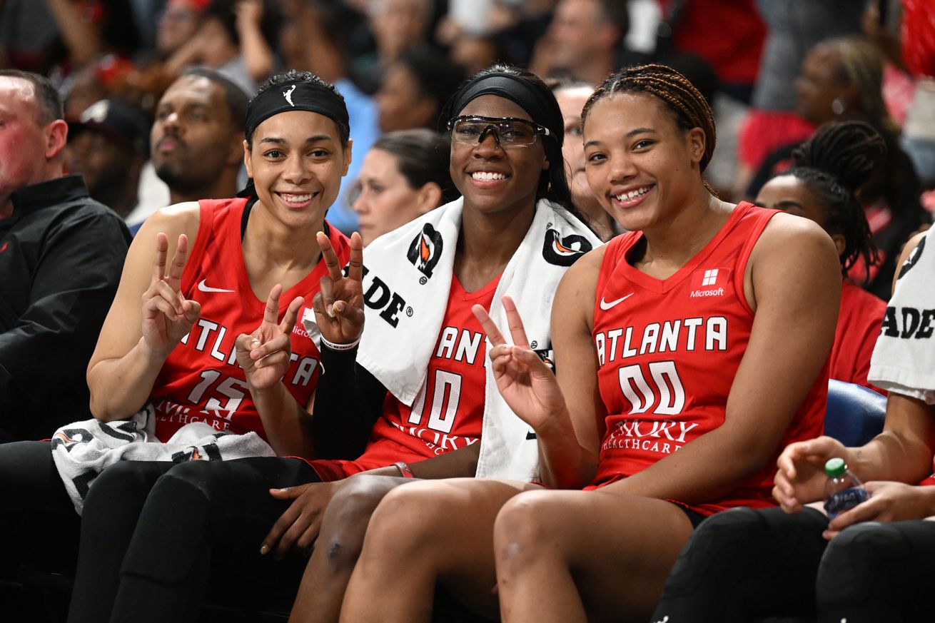 Atlanta Dream returning players Allisha Gray, Naz Hillmon, and Rhyne Howard showing peace signs to the camera