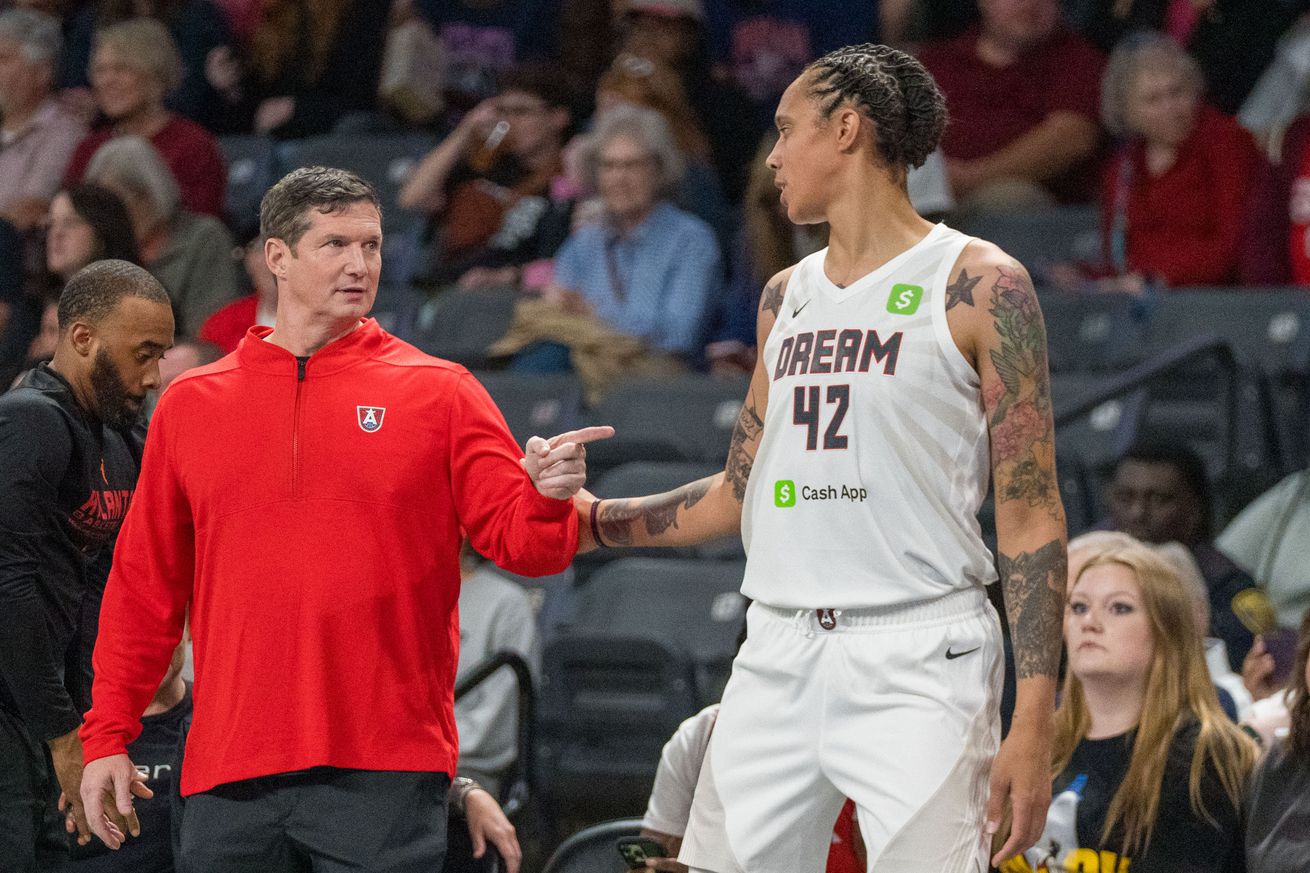 Atlanta Dream Head Coach Karl Smesko talks with newly-signed free agent Brittney Griner