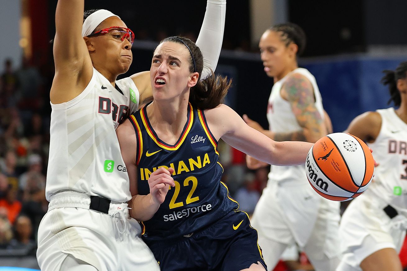 Indiana Fever guard Caitlin Clark drives to the basket against Atlanta Dream guard Allisha Gray