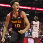 Atlanta Hawks forward Zaccharie Risacher (10) reacts after scoring a basket against the Miami Heat during the first half at State Farm Arena.