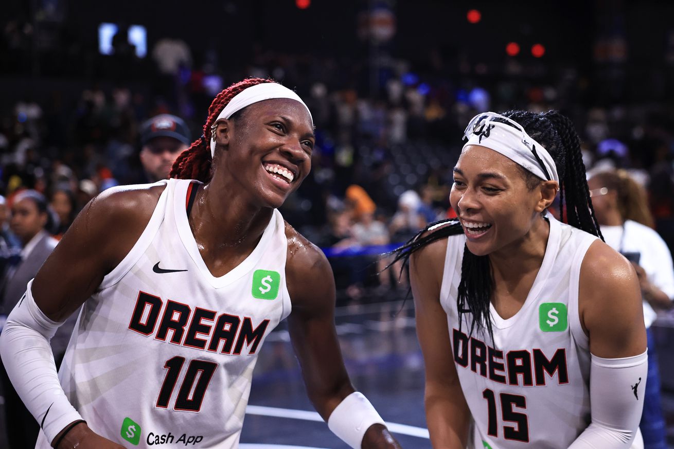 Allisha Gray and Rhyne Howard of the Atlanta Dream smile after the game against the Chicago Sky